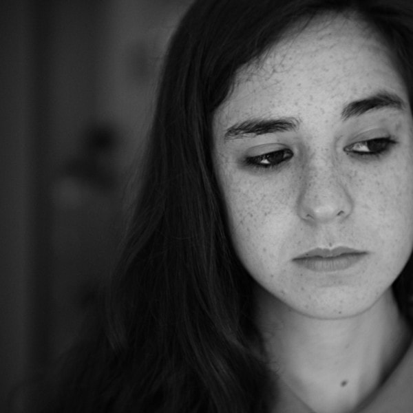 Young woman looking anxious