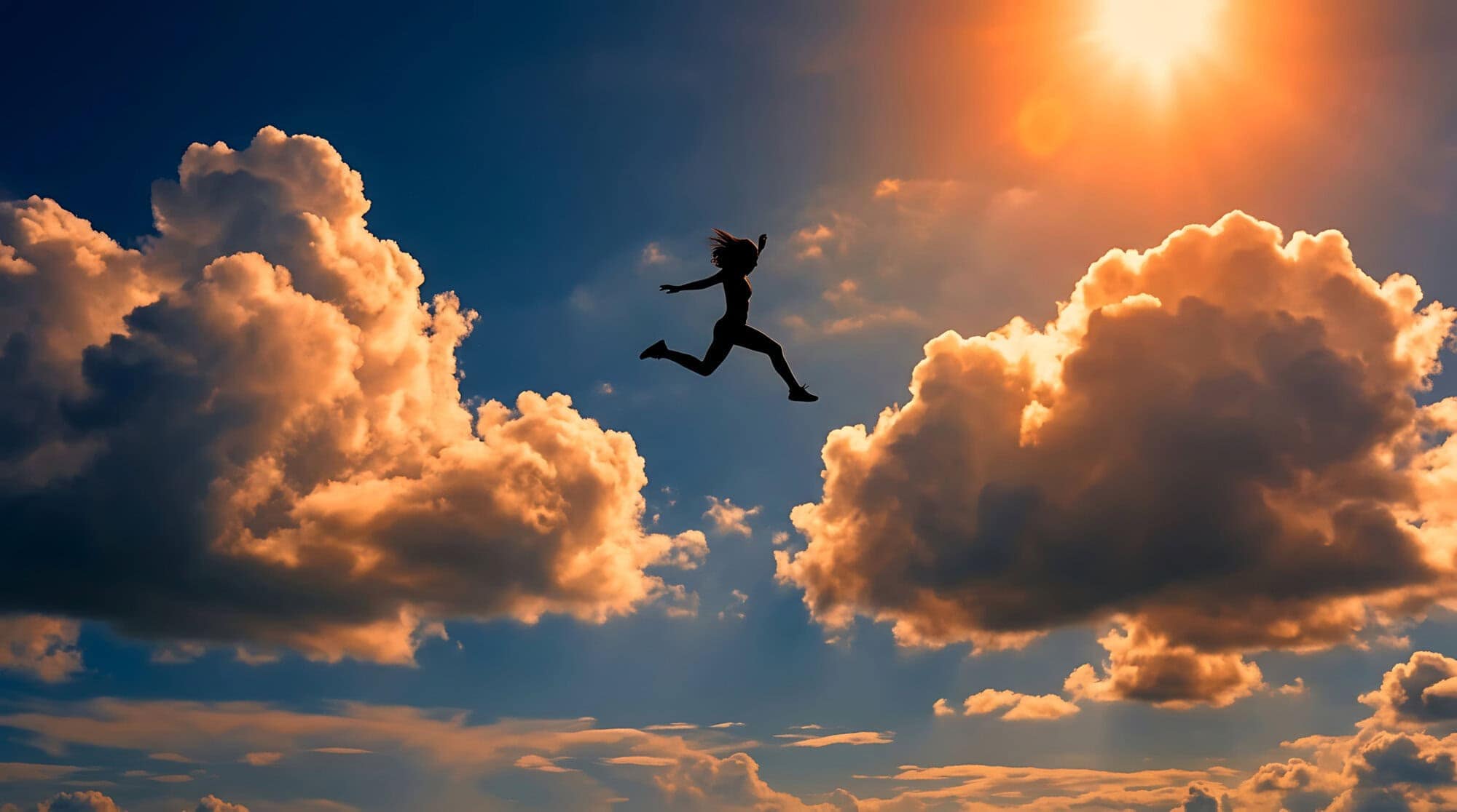 Silhouette of a person making an empowering leap amidst dramatic clouds, symbolizing boundless achievement